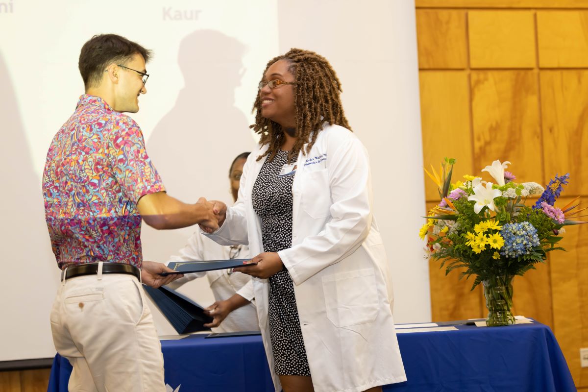 Student accepting an award at the 2023 Honors and Awards Ceremony